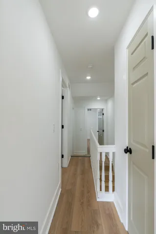 a view of room with wooden floor