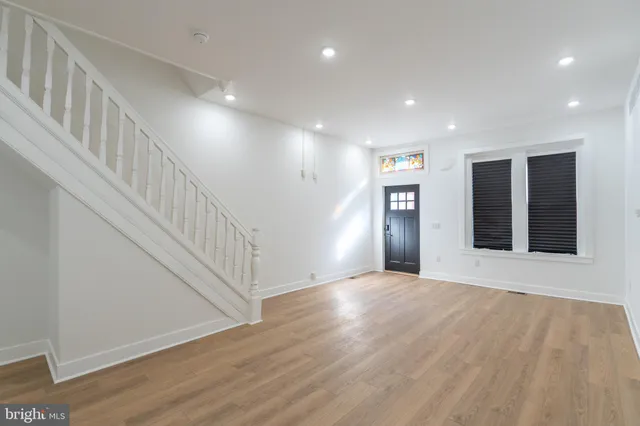 a view of an entryway with wooden floor