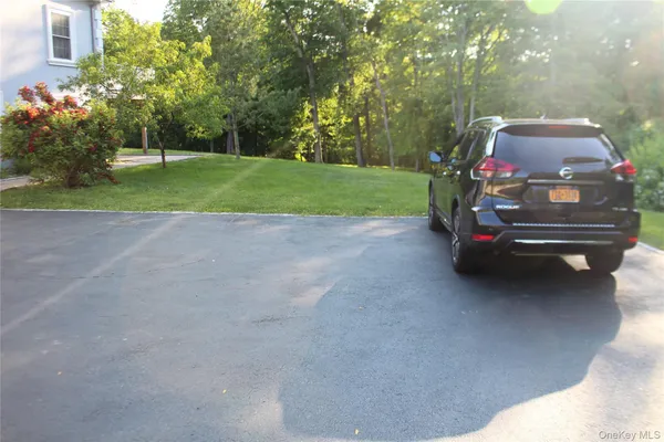 a car parked in the middle of a yard