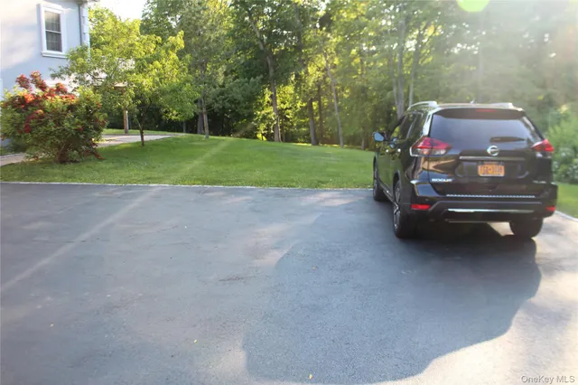 a car parked in the middle of a yard
