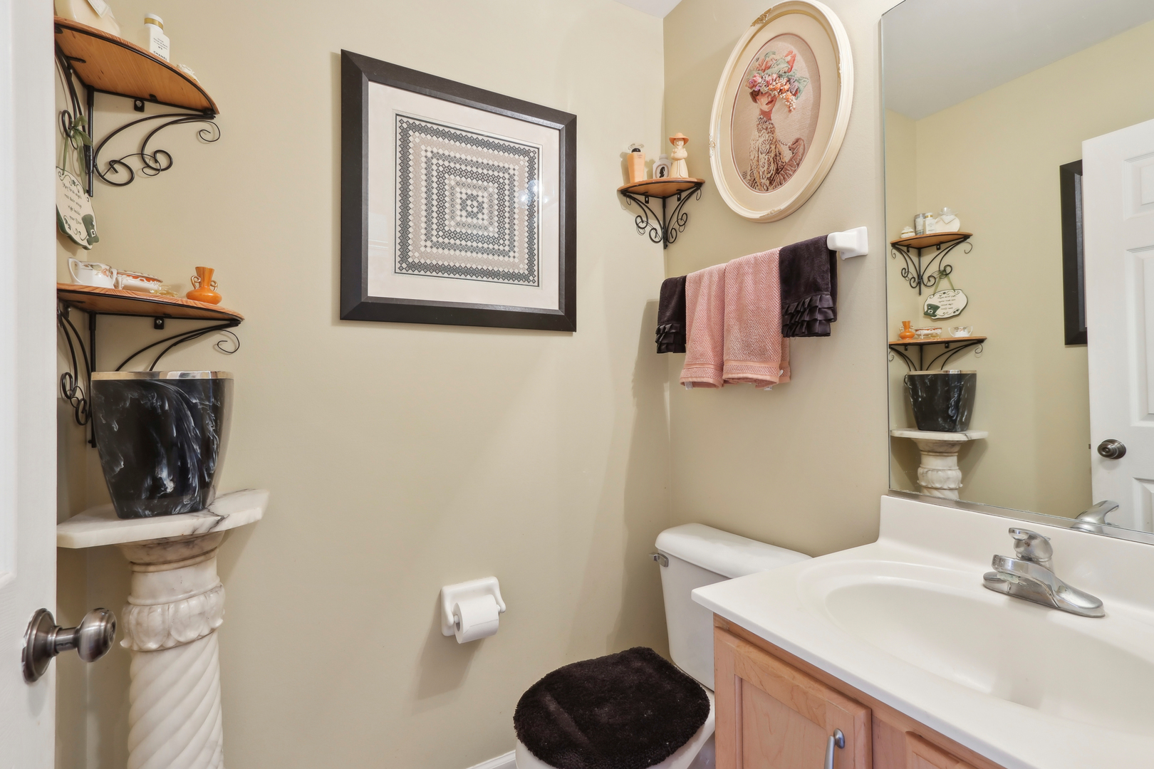 3304 Alyssa Street Plano, IL 60545 - Photo 14 of 30 a bathroom with a sink and a mirror