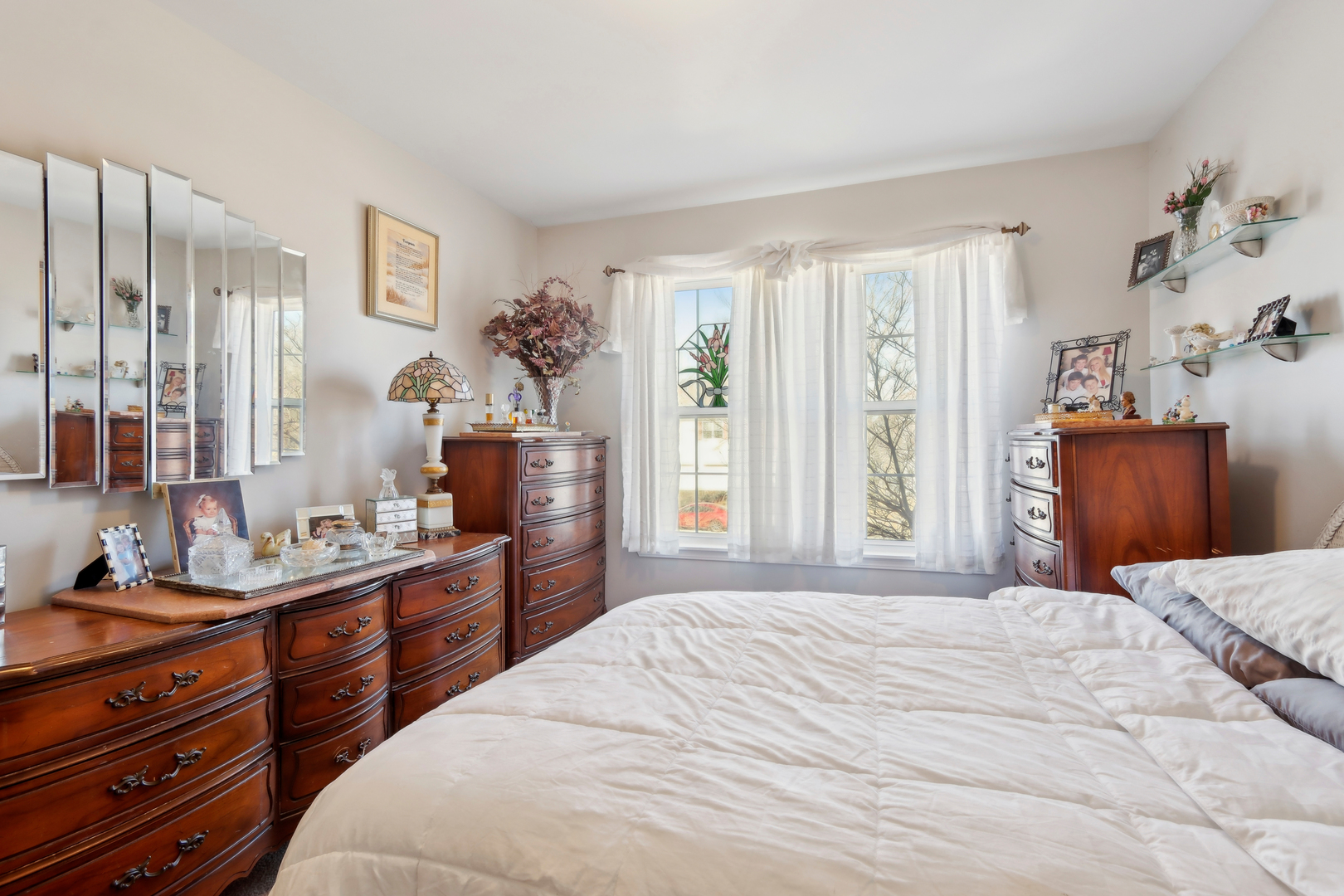 3304 Alyssa Street Plano, IL 60545 - Photo 19 of 30 a bedroom with a bed flat screen tv and a large window