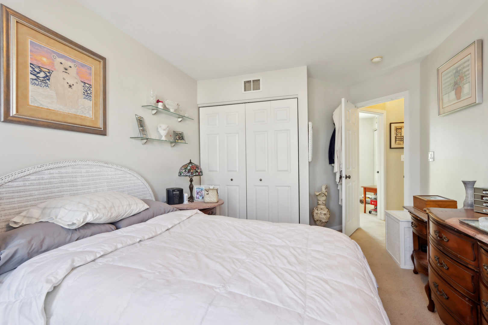 3304 Alyssa Street Plano, IL 60545 - Photo 20 of 30 a bedroom with a large bed and a chandelier