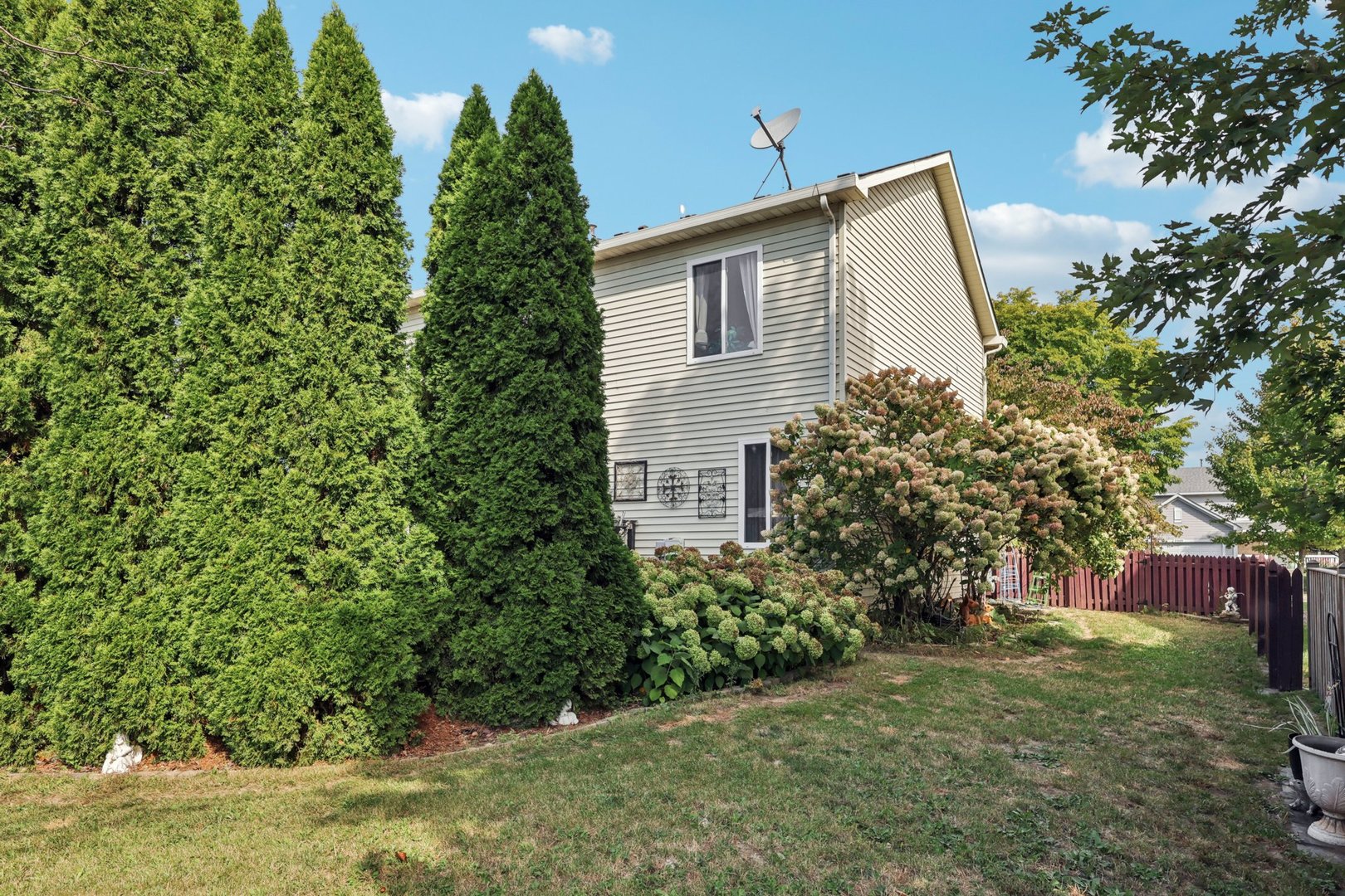 3304 Alyssa Street Plano, IL 60545 - Photo 28 of 30 a view of a house with a yard and plants