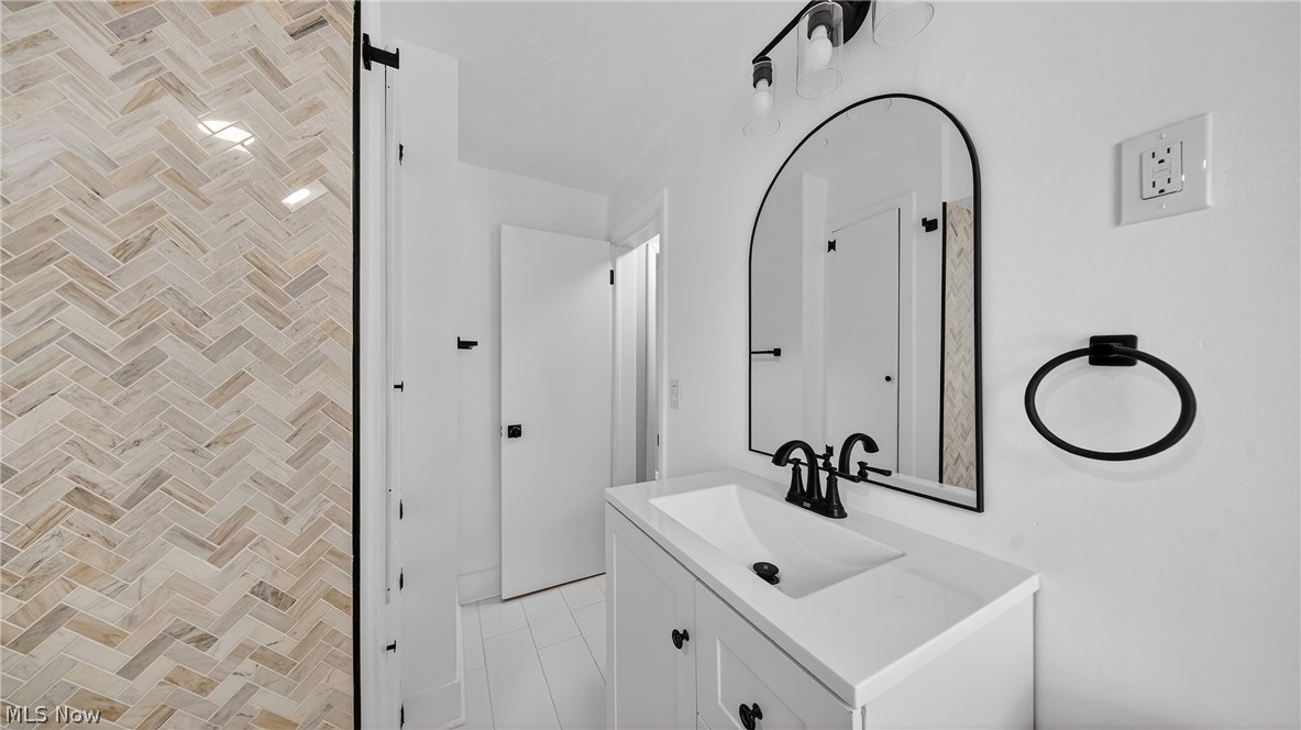 16811 Invermere Avenue Cleveland, OH 44128 - Photo 28 of 47 Bathroom with vanity and light tile patterned flooring
