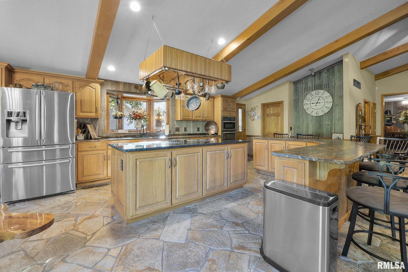1810 Berryville Road Jonesboro, IL 62952 - Photo 23 of 60 a kitchen with cabinets and chairs