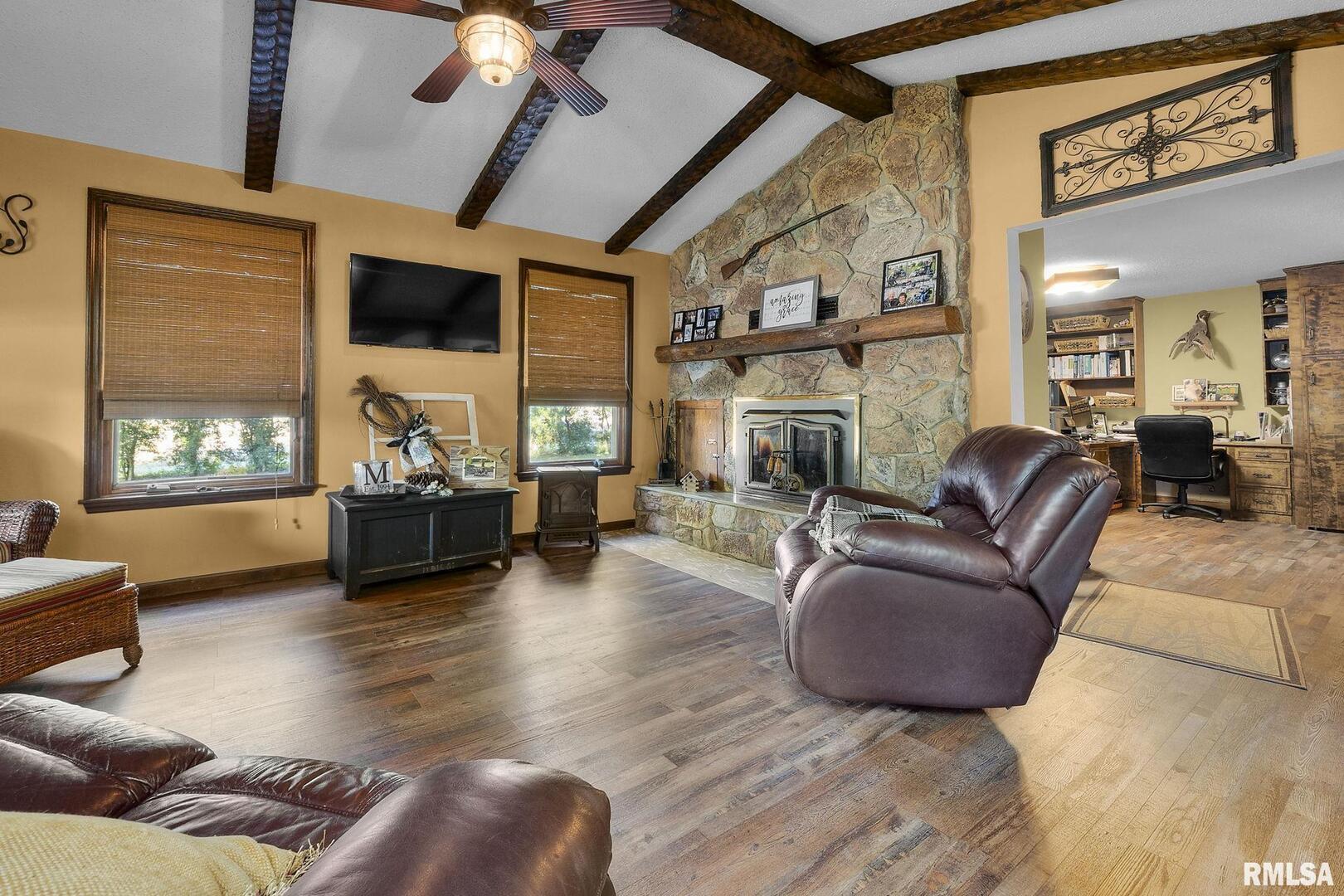 1810 Berryville Road Jonesboro, IL 62952 - Photo 30 of 60 a living room with furniture fireplace and flat screen tv