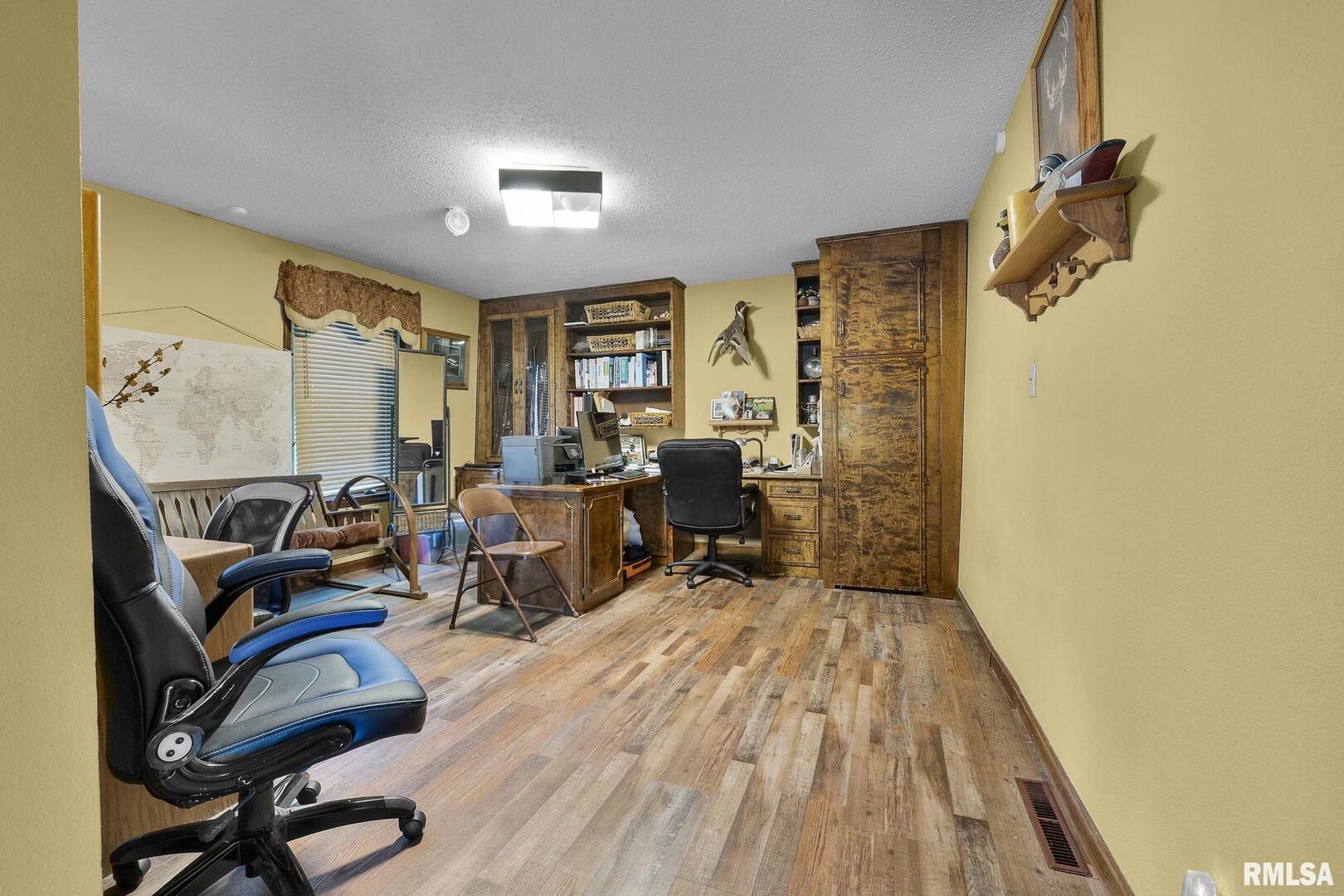 1810 Berryville Road Jonesboro, IL 62952 - Photo 37 of 60 a view of a workspace with furniture and a window