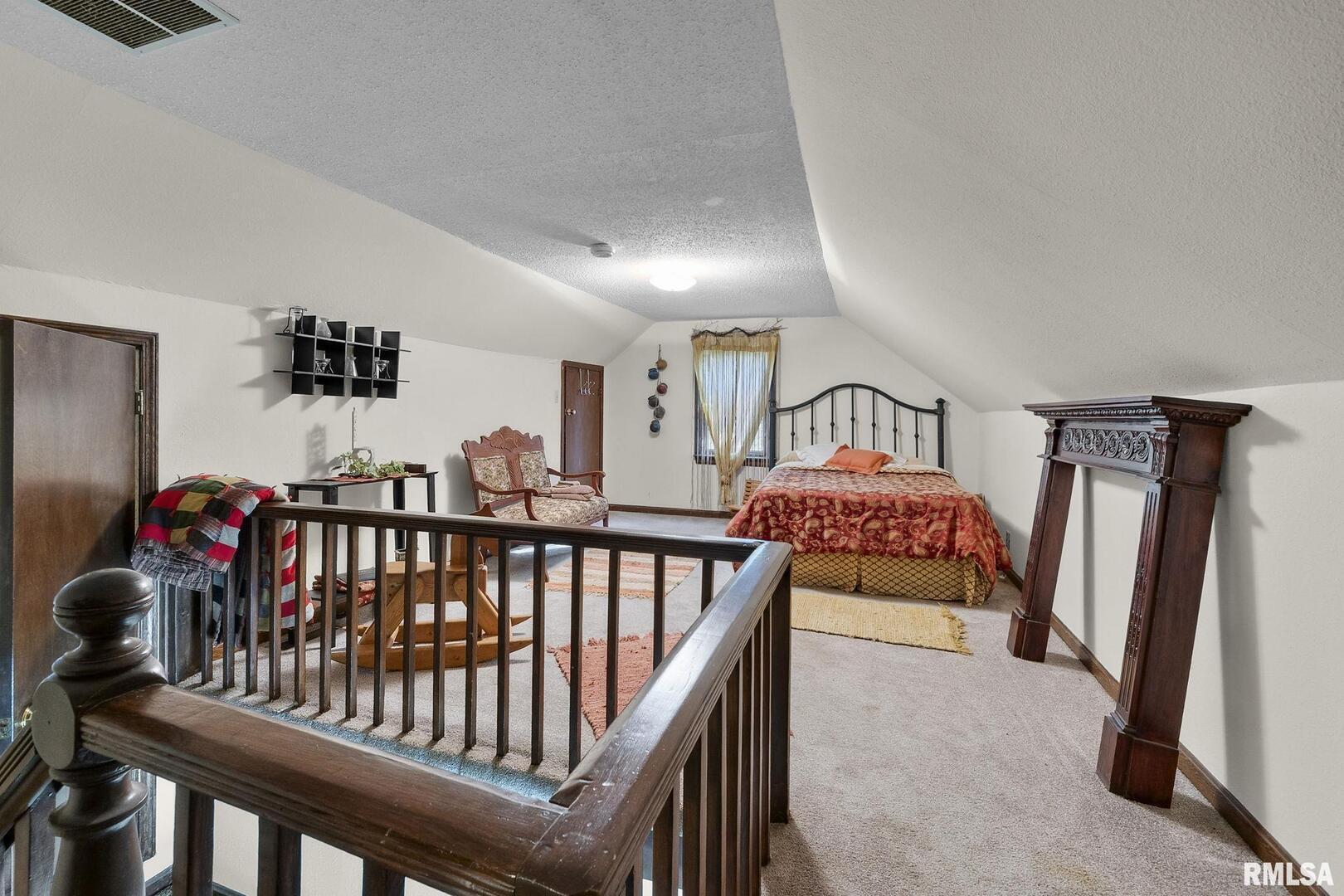 1810 Berryville Road Jonesboro, IL 62952 - Photo 38 of 60 a bedroom with furniture and a tv