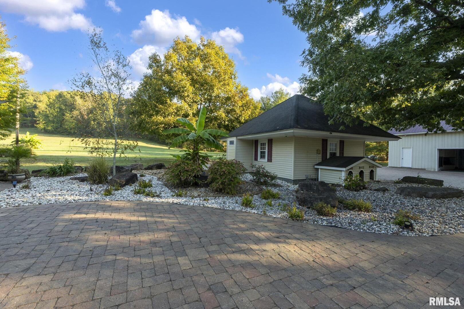 1810 Berryville Road Jonesboro, IL 62952 - Photo 10 of 60 a front view of a house with garden