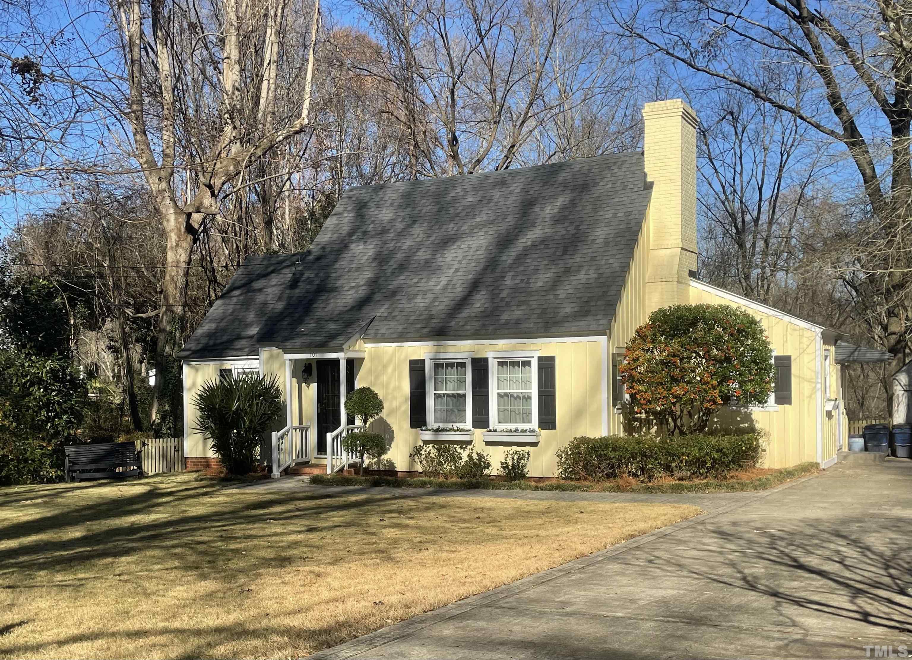 a view of a house with a yard and plants