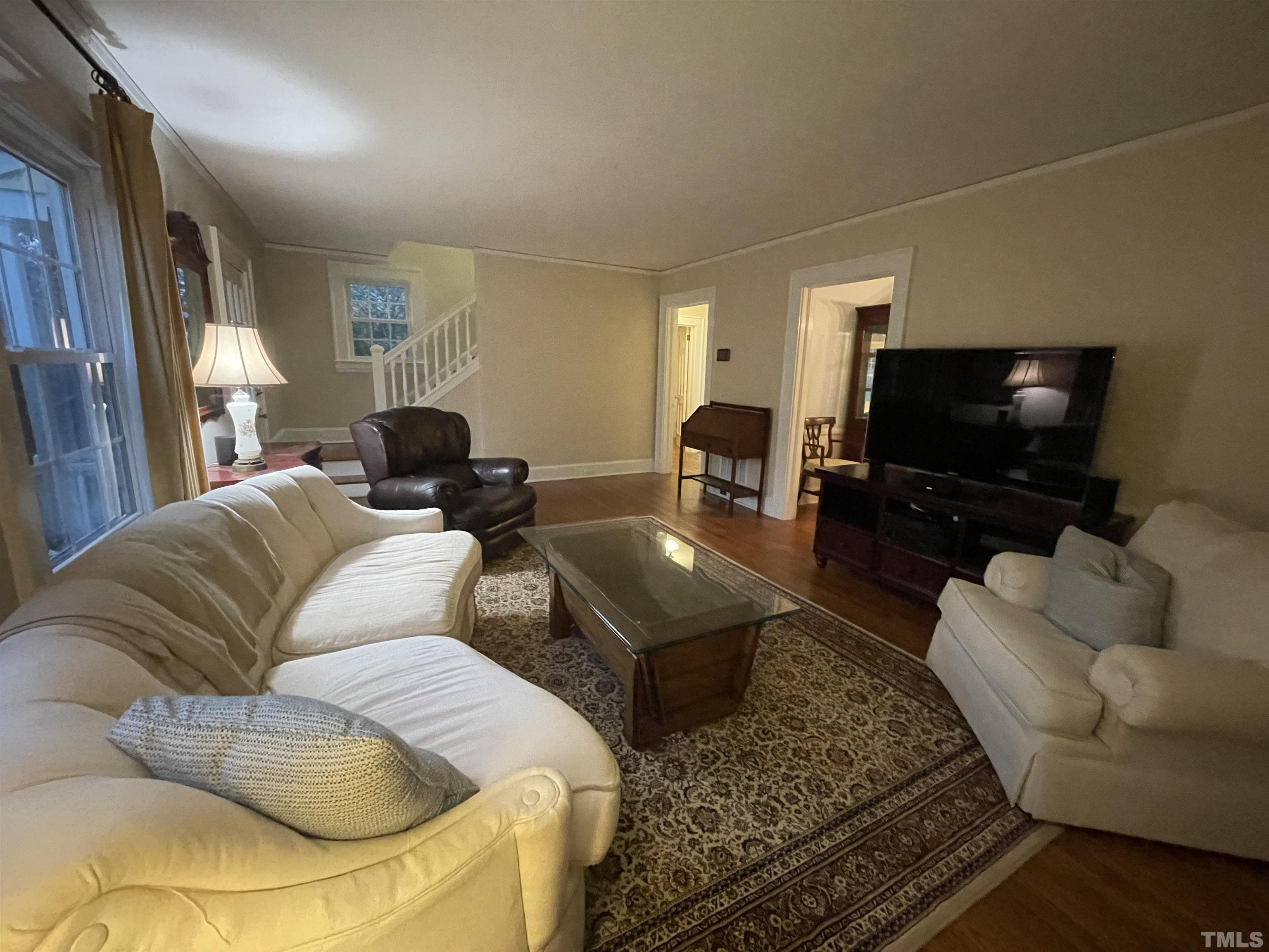 101 East Riverside Drive Smithfield, NC 27577 - Photo 11 of 38 a living room with furniture and a flat screen tv