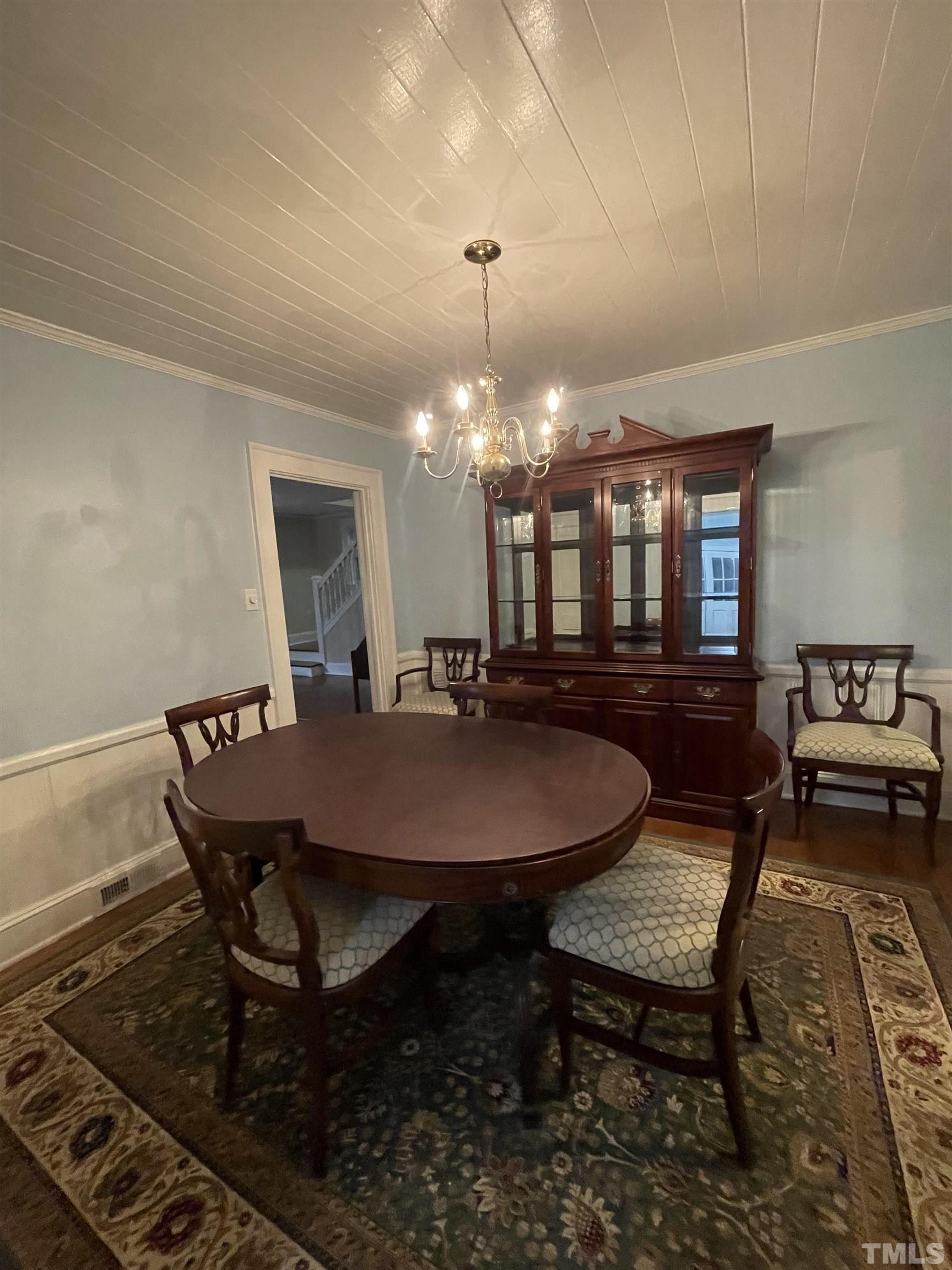 101 East Riverside Drive Smithfield, NC 27577 - Photo 13 of 38 a dining room with a table chairs and a kitchen view
