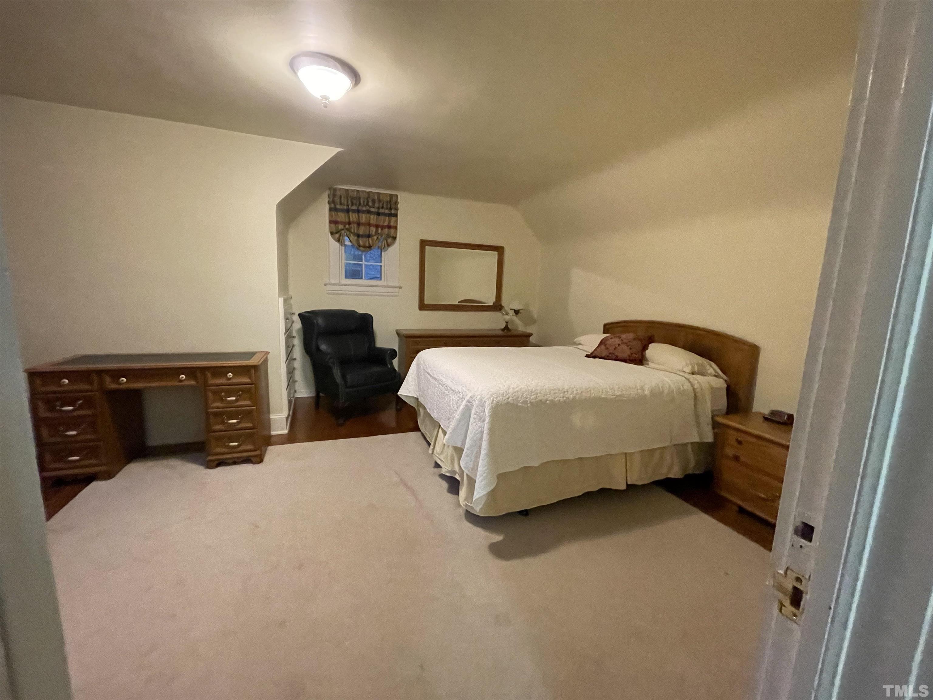 101 East Riverside Drive Smithfield, NC 27577 - Photo 21 of 38 a bedroom with a bed and a night stand
