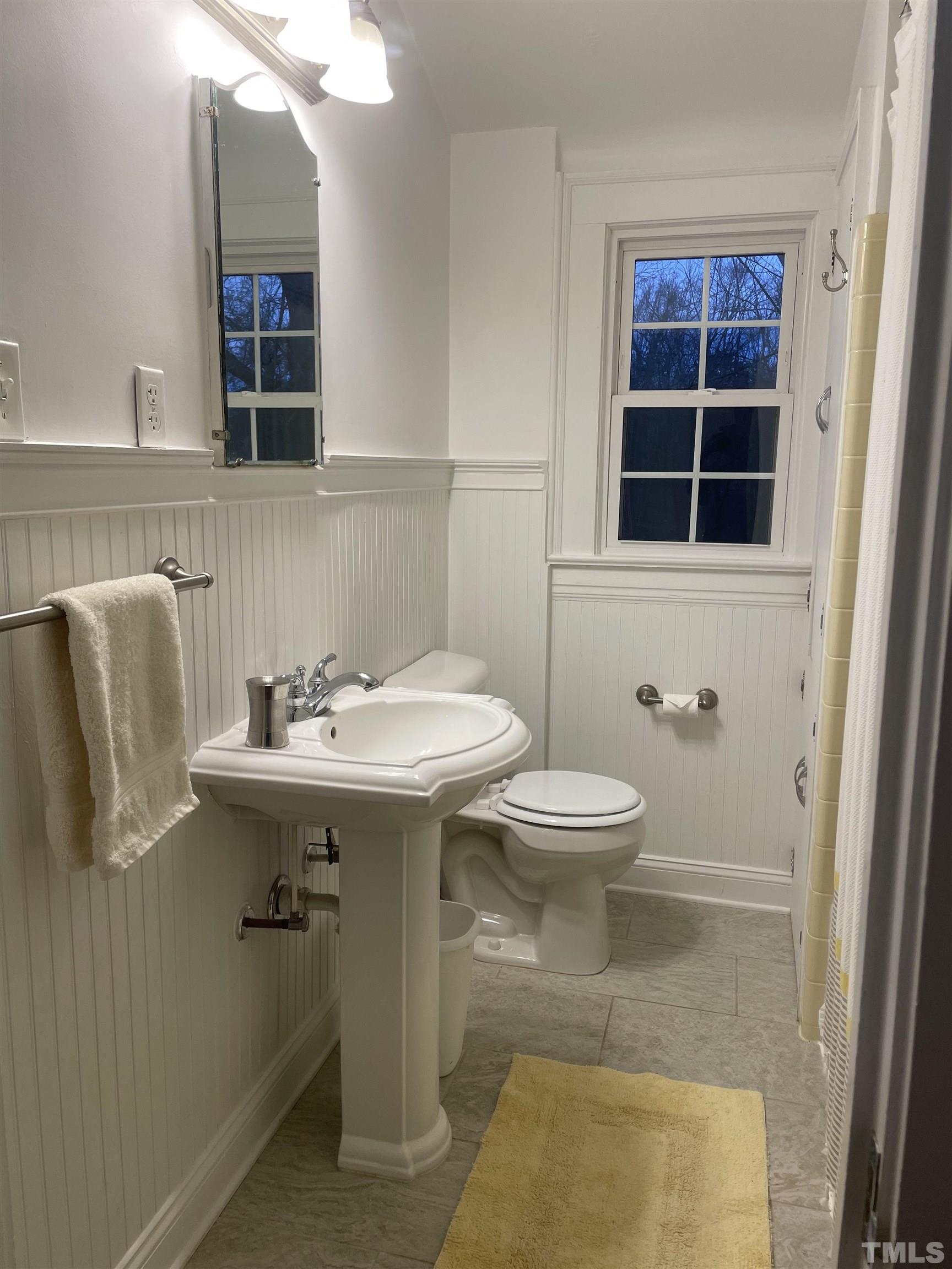 101 East Riverside Drive Smithfield, NC 27577 - Photo 24 of 38 a bathroom with a sink toilet and mirror