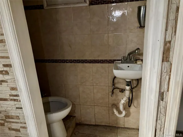 a bathroom with a shower and toilet