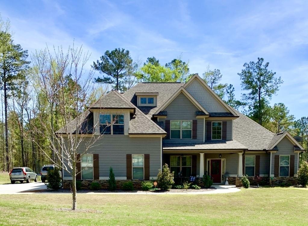 1139 Pleasant Ridge Road Carrollton, GA 30117 - Photo 1 of 1 a front view of a house with a yard
