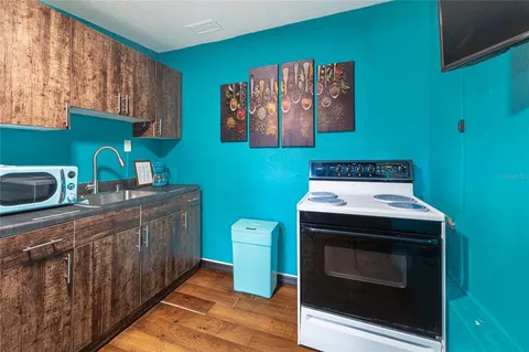 a kitchen with a stove and a sink