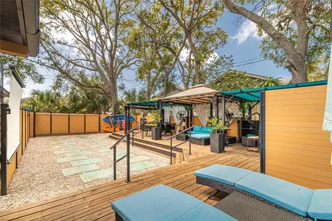 swimming pool view with a seating space