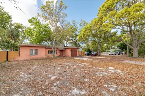 a view of a house with a yard and garage