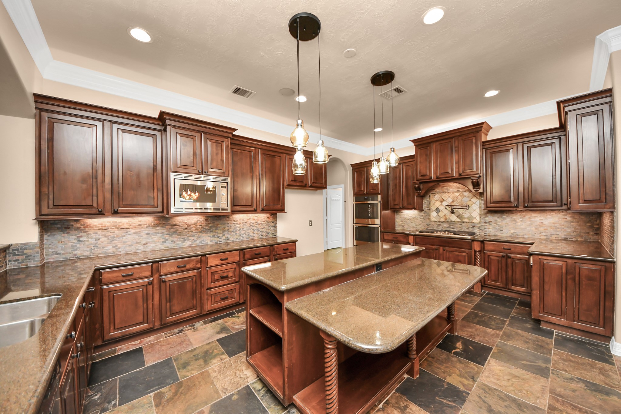 3511 River Bend Drive Rosenberg, TX 77471 - Photo 15 of 50 a kitchen with a stove a refrigerator a sink and chairs
