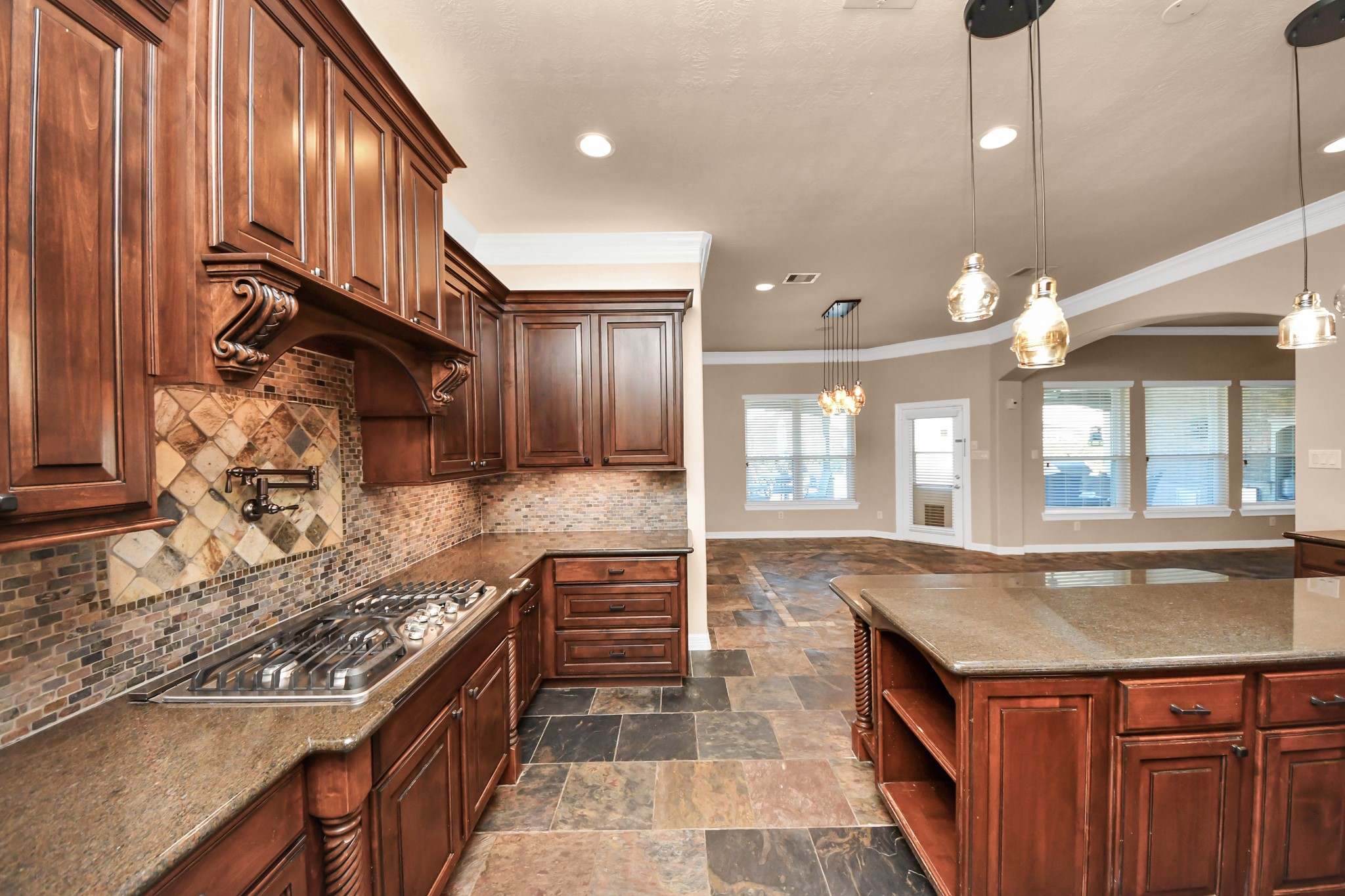 3511 River Bend Drive Rosenberg, TX 77471 - Photo 18 of 50 a kitchen with stainless steel appliances granite countertop a sink and a stove