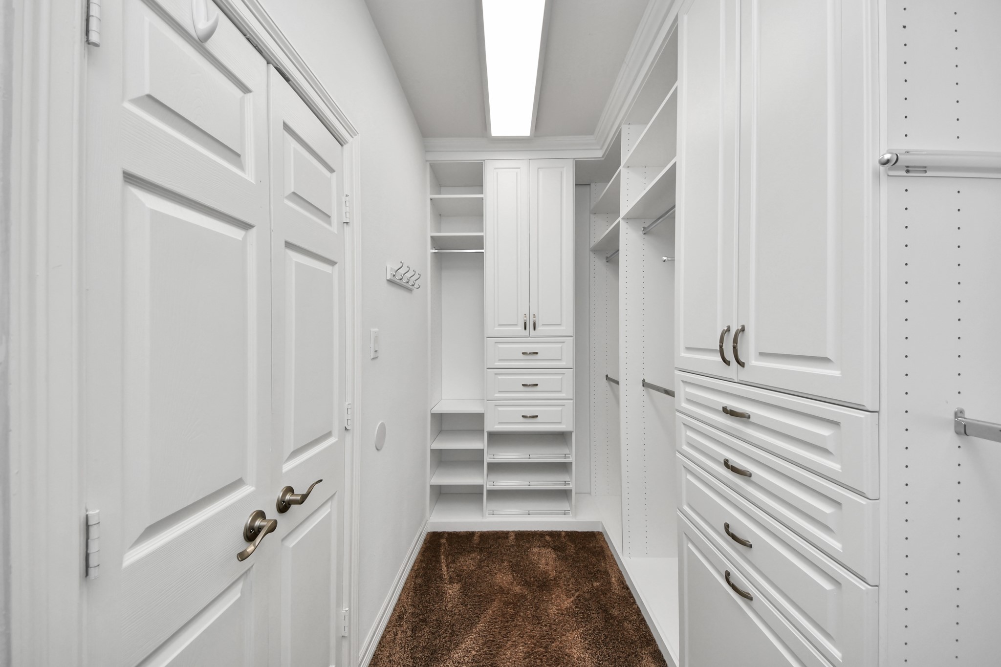 3511 River Bend Drive Rosenberg, TX 77471 - Photo 26 of 50 a view of a hallway with closet and cabinet