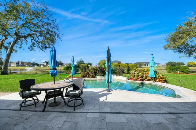 a view of a backyard with sitting area