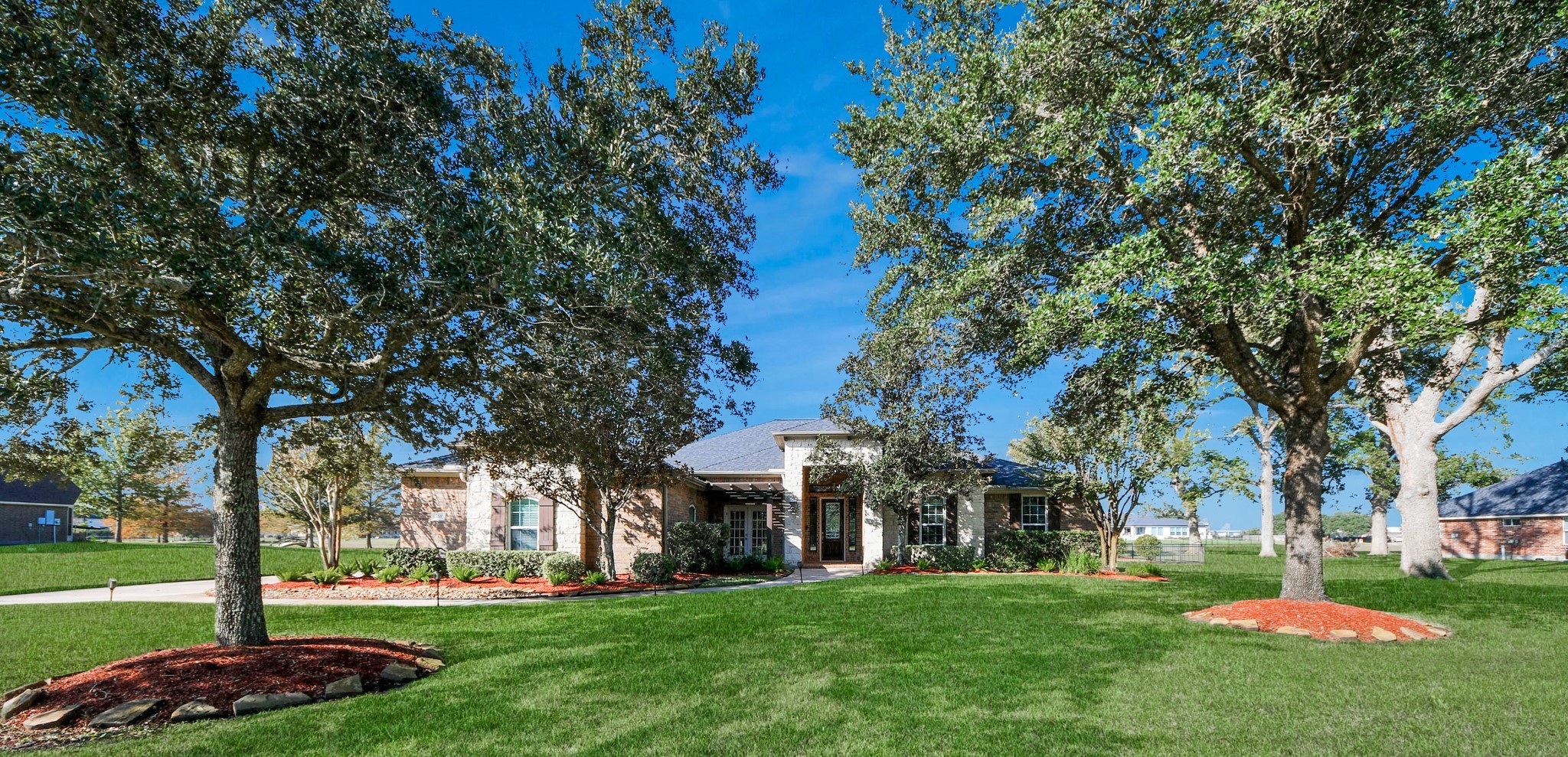 3511 River Bend Drive Rosenberg, TX 77471 - Photo 49 of 50 a front view of a building with a garden
