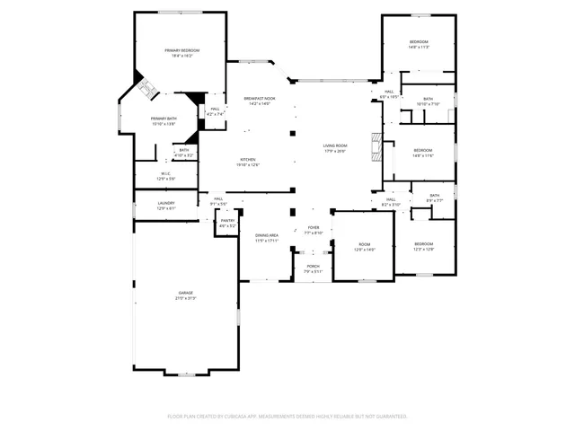 a front view of a building with a garden