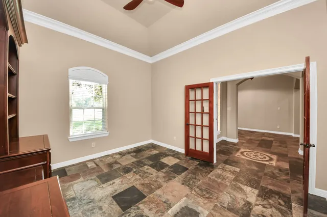 a room with a dresser and a window