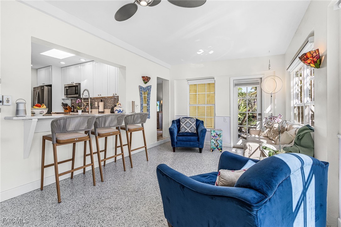 11860 Island Avenue Matlacha, FL 33993 - Photo 13 of 41 a living room with furniture and a large window