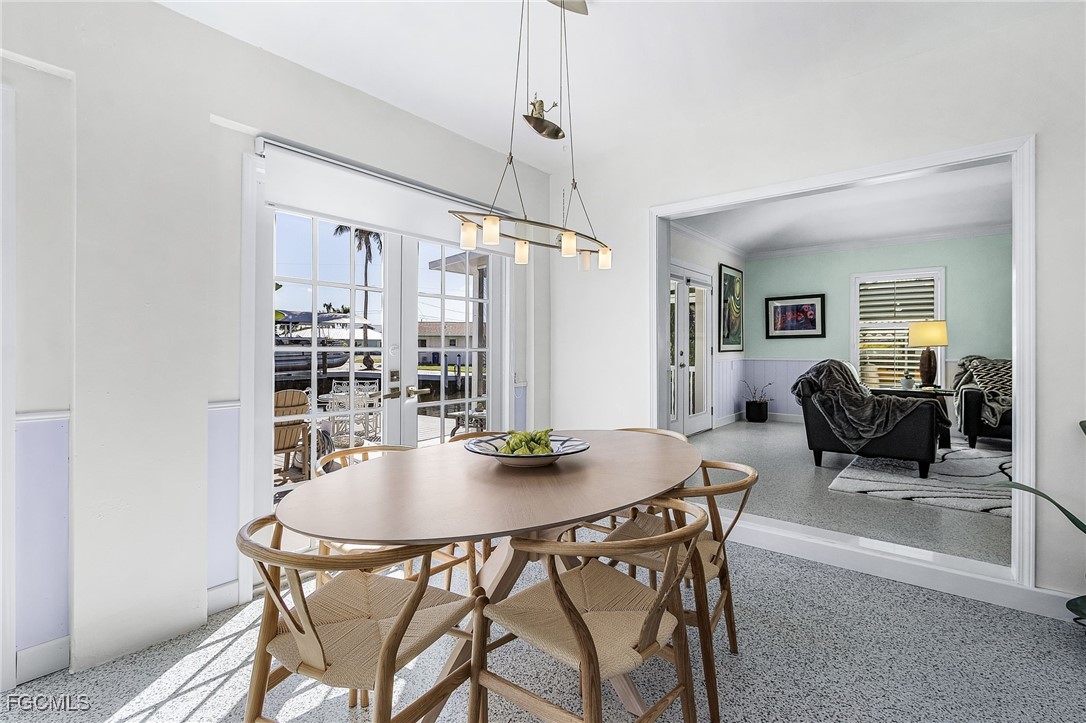 11860 Island Avenue Matlacha, FL 33993 - Photo 14 of 41 a dining room with furniture and window