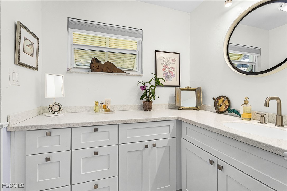 11860 Island Avenue Matlacha, FL 33993 - Photo 17 of 41 a bathroom with a sink and a mirror