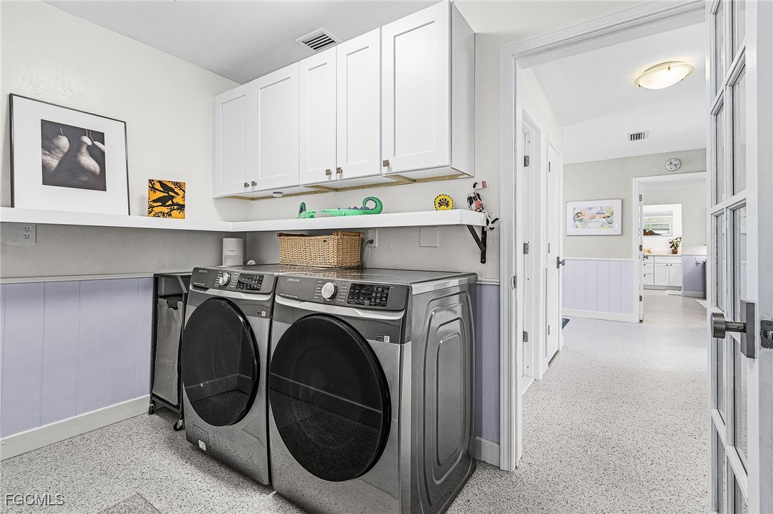 11860 Island Avenue Matlacha, FL 33993 - Photo 22 of 41 a utility room with dryer and washer