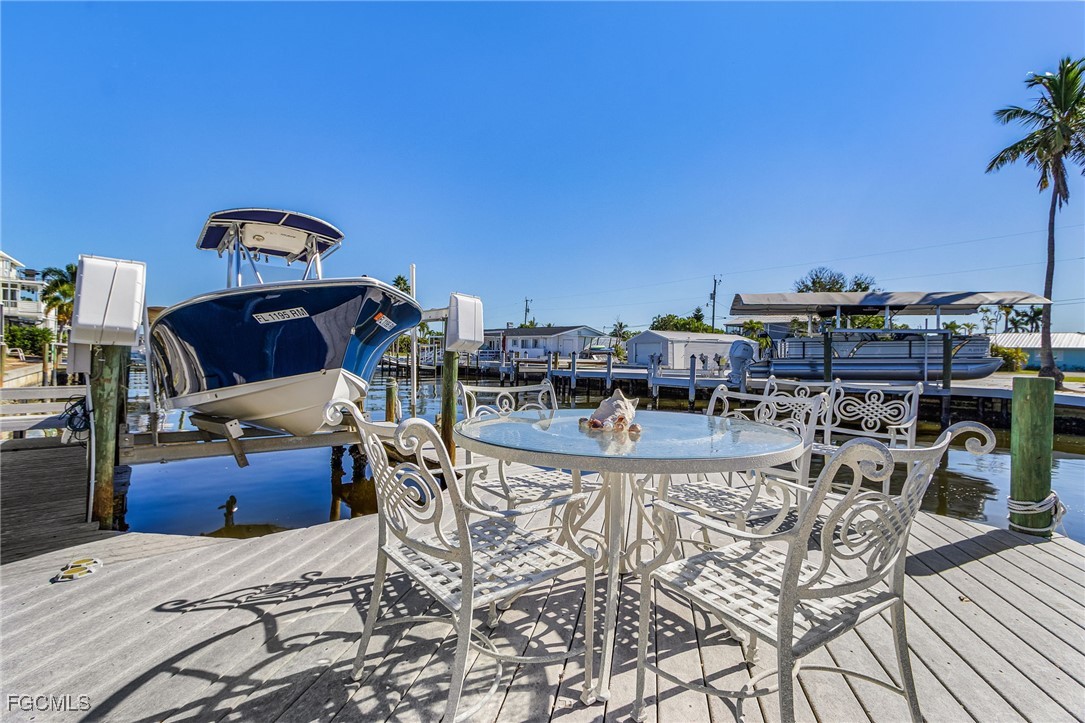 11860 Island Avenue Matlacha, FL 33993 - Photo 28 of 41 a view of a swimming pool with outdoor seating