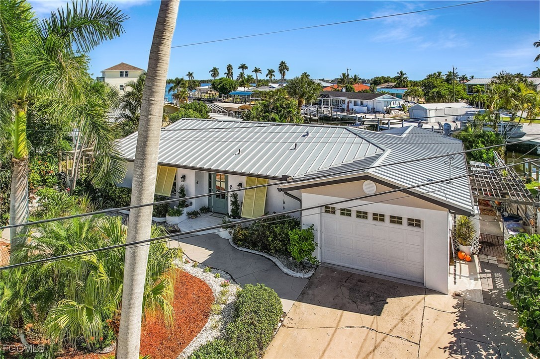 11860 Island Avenue Matlacha, FL 33993 - Photo 33 of 41 a view of a house with outdoor space and sitting area