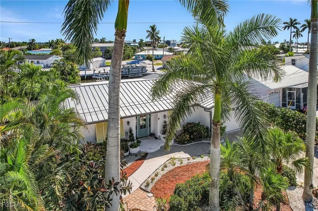 an aerial view of a building and yard