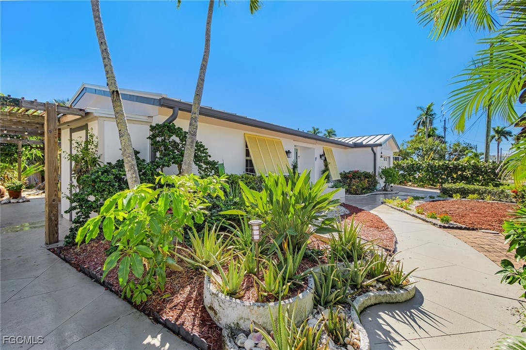 11860 Island Avenue Matlacha, FL 33993 - Photo 35 of 41 a house view with a garden space
