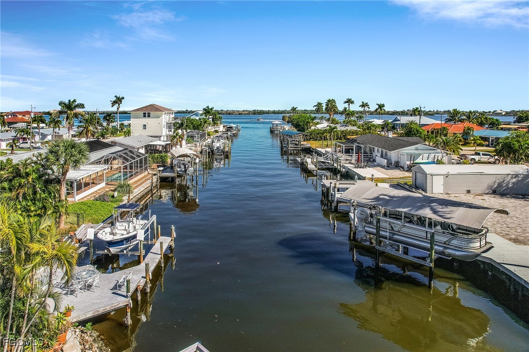 11860 Island Avenue Matlacha, FL 33993 - Photo 41 of 41 a view of a swimming pool with lawn chairs