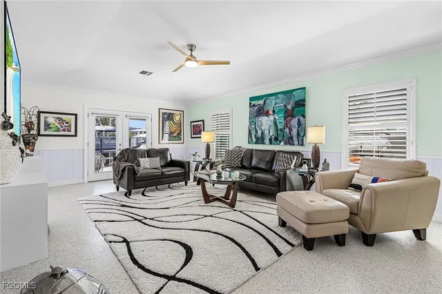 a dining room with furniture a window and a chandelier
