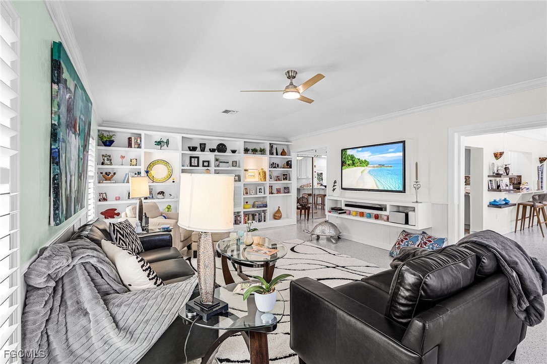 11860 Island Avenue Matlacha, FL 33993 - Photo 10 of 41 a living room with furniture and a flat screen tv