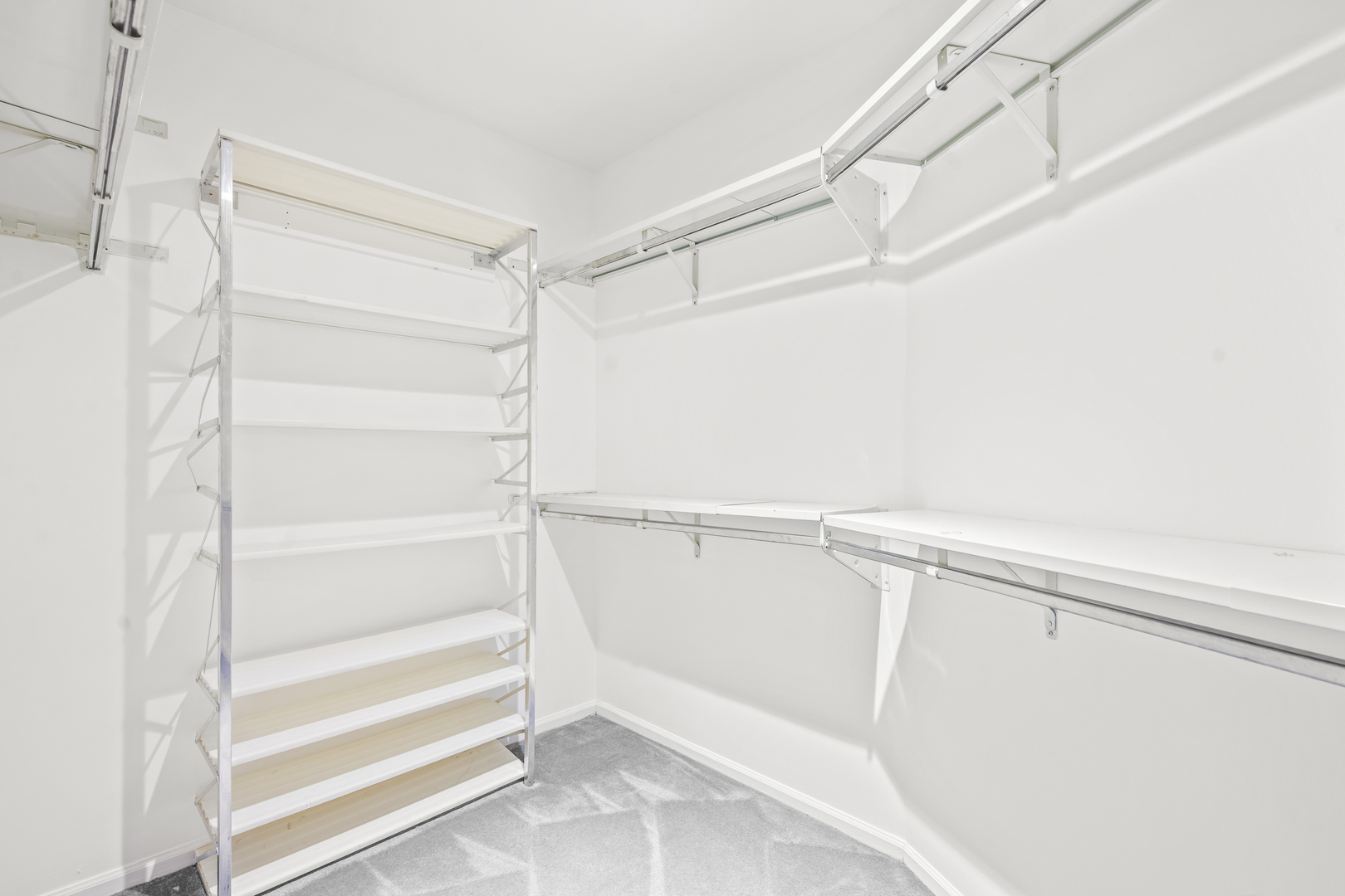 1125 Lake Cook Road, Unit 405 Northbrook, IL 60062 - Photo 13 of 18 a view of walk in closet with empty racks