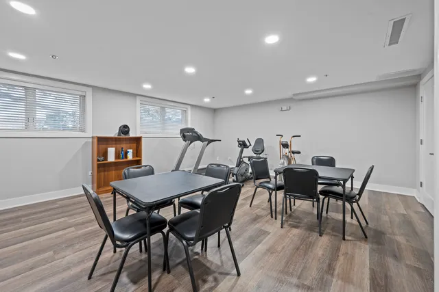 a view of a dining room with furniture and wooden floor