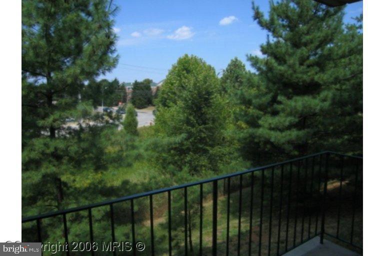1002 Spring Gate Road, Unit 2C Baltimore, MD 21228 - Photo 12 of 12 a view of a balcony with an outdoor space
