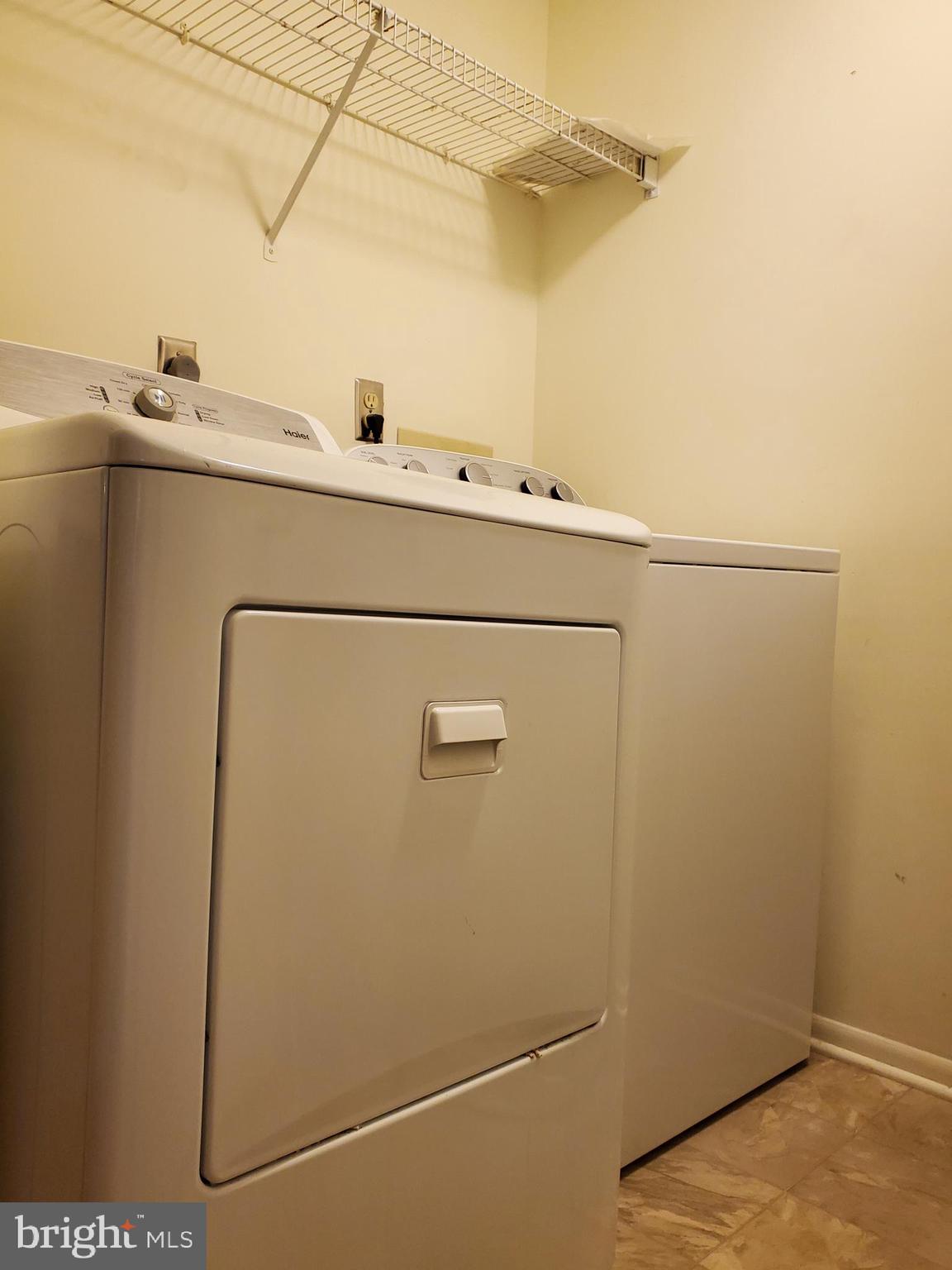 1002 Spring Gate Road, Unit 2C Baltimore, MD 21228 - Photo 8 of 12 a utility room with dryer and washer