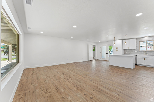 1898 West 600 South Provo, UT 84601 - Photo 10 of 32 Spacious open-concept living area featuring wood-finish flooring, recessed lighting, and a large window