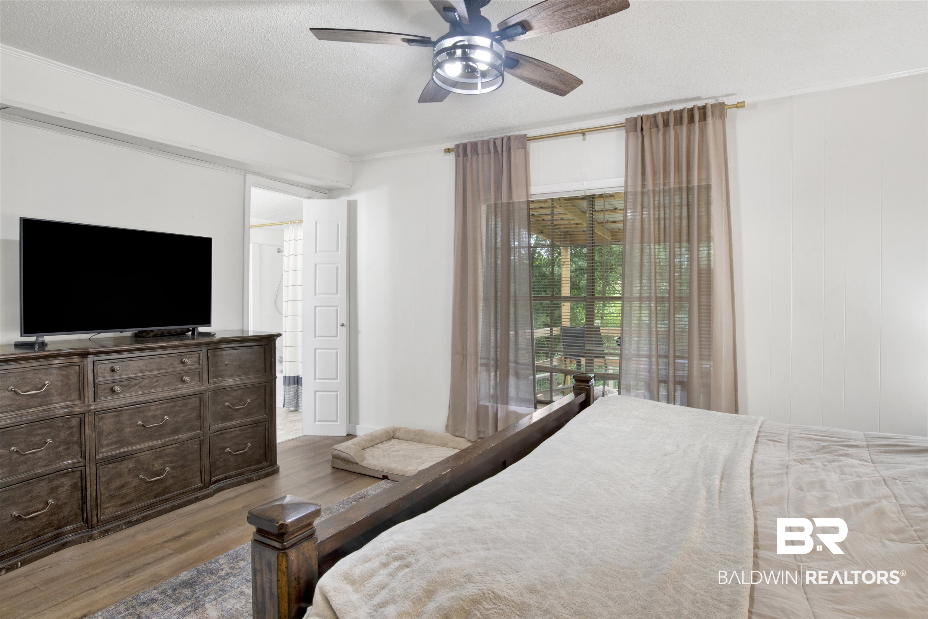 4265 Greaves Road Eight Mile, AL 36613 - Photo 13 of 34 Bedroom featuring light wood finished floors, ceiling fan, and a textured ceiling