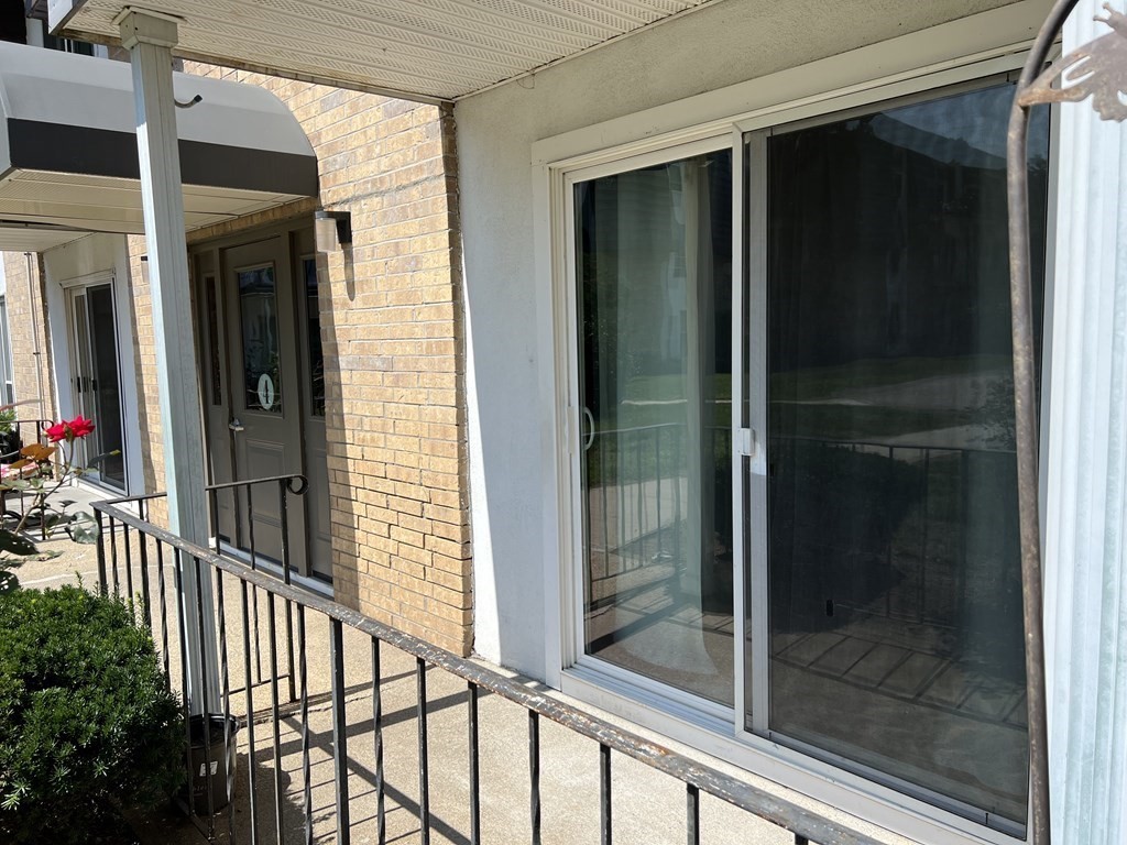 4 Shadowbrook Lane, Unit 6 Milford, MA 01757 - Photo 3 of 16 a view of a glass door and a window
