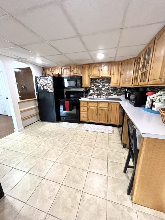 4 Shadowbrook Lane, Unit 6 Milford, MA 01757 - Photo 5 of 16 a kitchen with stainless steel appliances kitchen island granite countertop a refrigerator and a sink